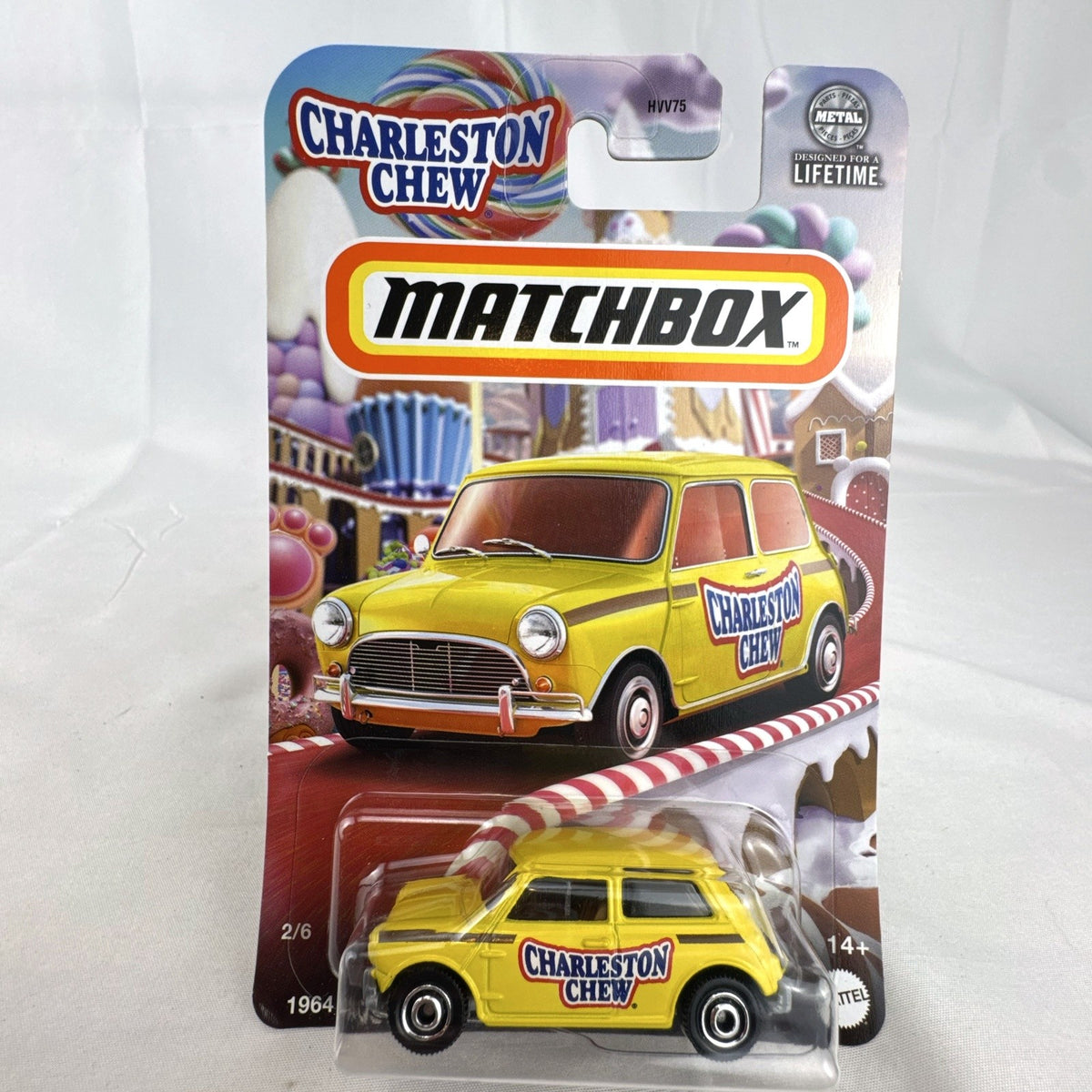 Matchbox 1:64 scale 1964 Austin Mini Cooper in yellow with Charleston Chew Tootsie Roll graphics sealed on card
