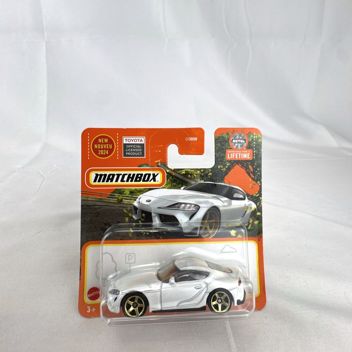 Matchbox 1:64 scale 2023 Toyota GR Supra diecast car in pearl white with gold wheels unopened on original card