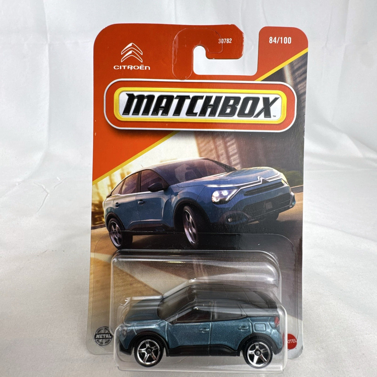 Matchbox 1:64 scale 2023 Citroën ë-C4 diecast car in metallic blue, factory sealed on original card