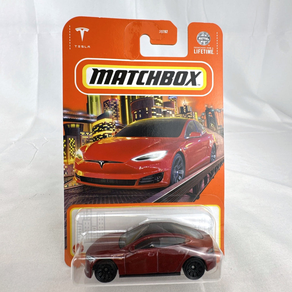 Matchbox 1:64 scale Tesla Model S diecast car in metallic dark red, factory sealed on original cardback
