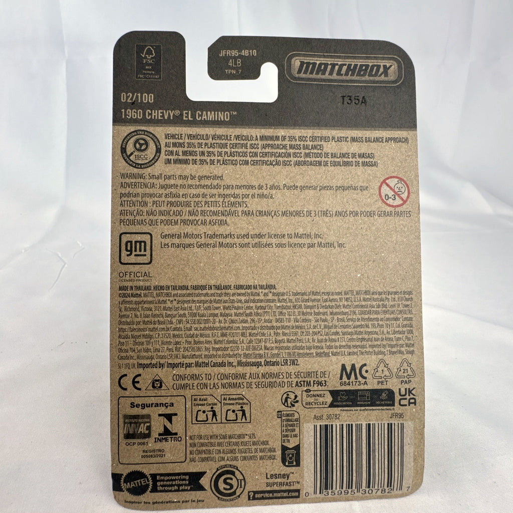 Matchbox 1:64 scale diecast 1960 Chevrolet El Camino pickup truck in metallic light blue unopened blister card packaging.