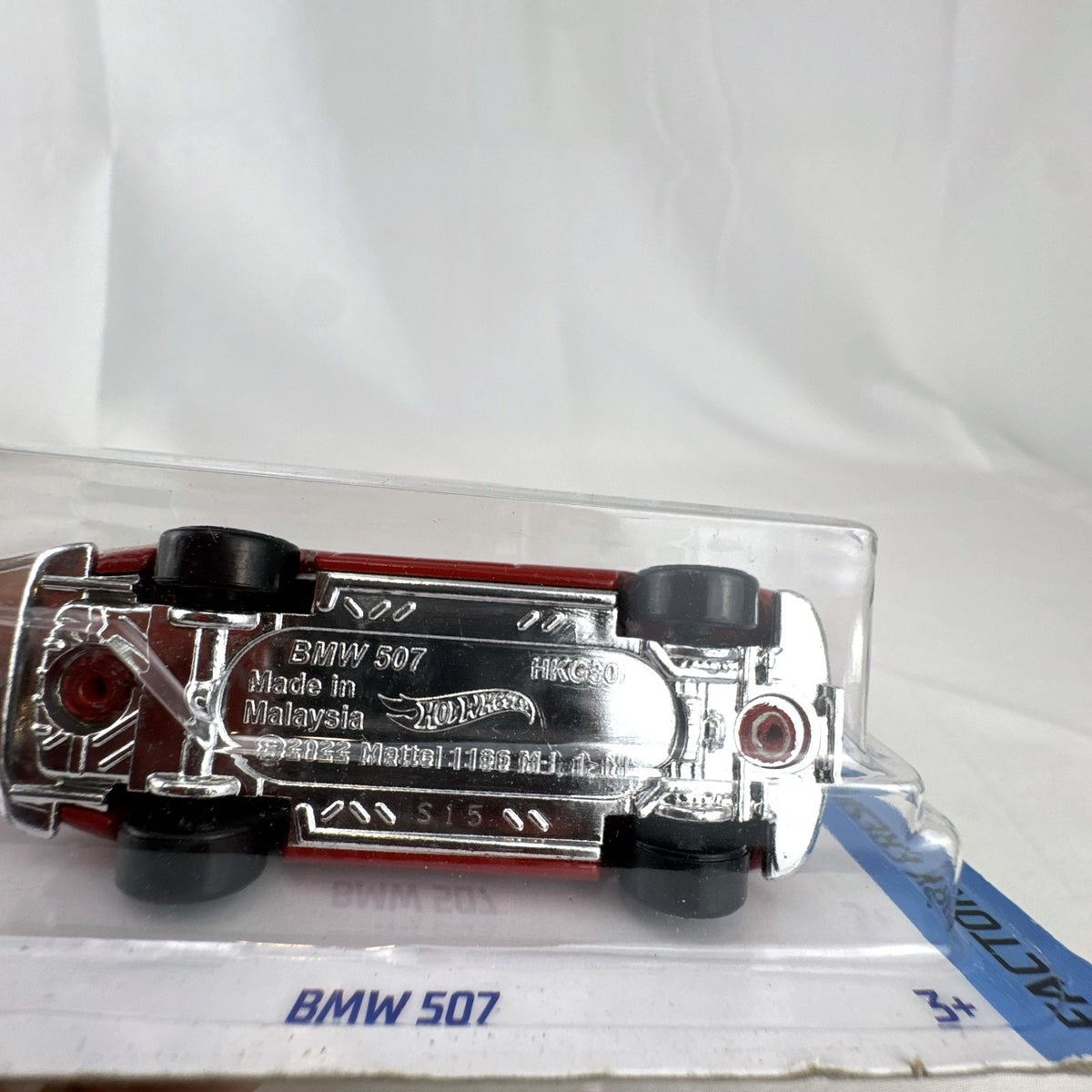 Hot Wheels 1:64 scale 1956 BMW 507 Roadster diecast car in factory red, sealed on card.