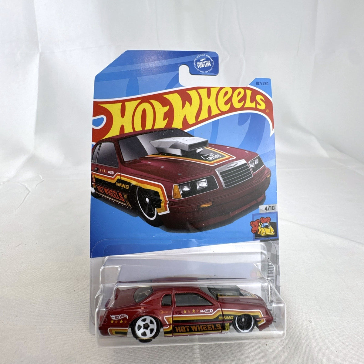 Sealed Hot Wheels 1:64 scale 1986 Ford Thunderbird Pro Stock diecast dragster in dark red metallic packaging.