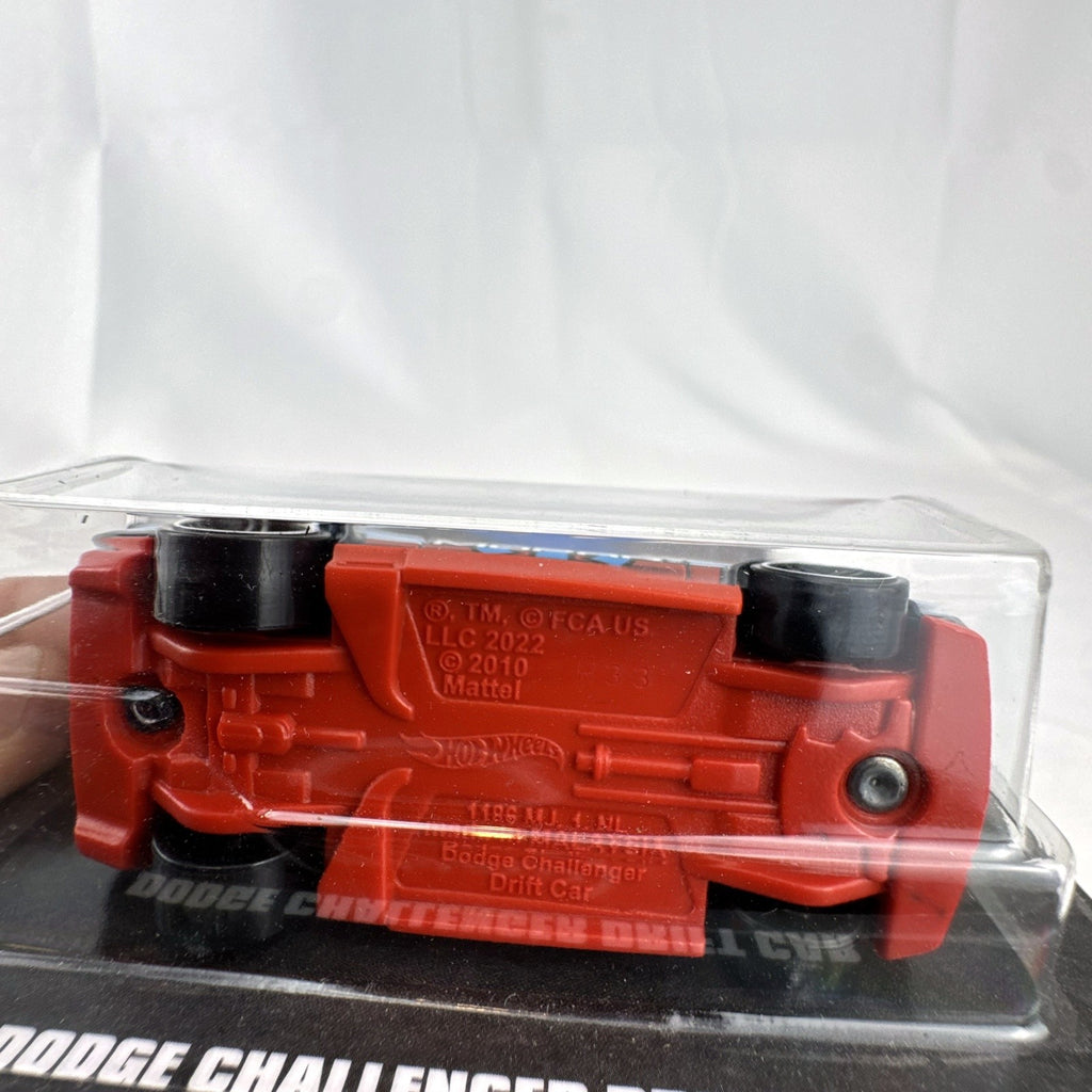 Sealed Hot Wheels 1:64 Dodge Challenger Drift Car in dark blue Mopar livery on original backing card.