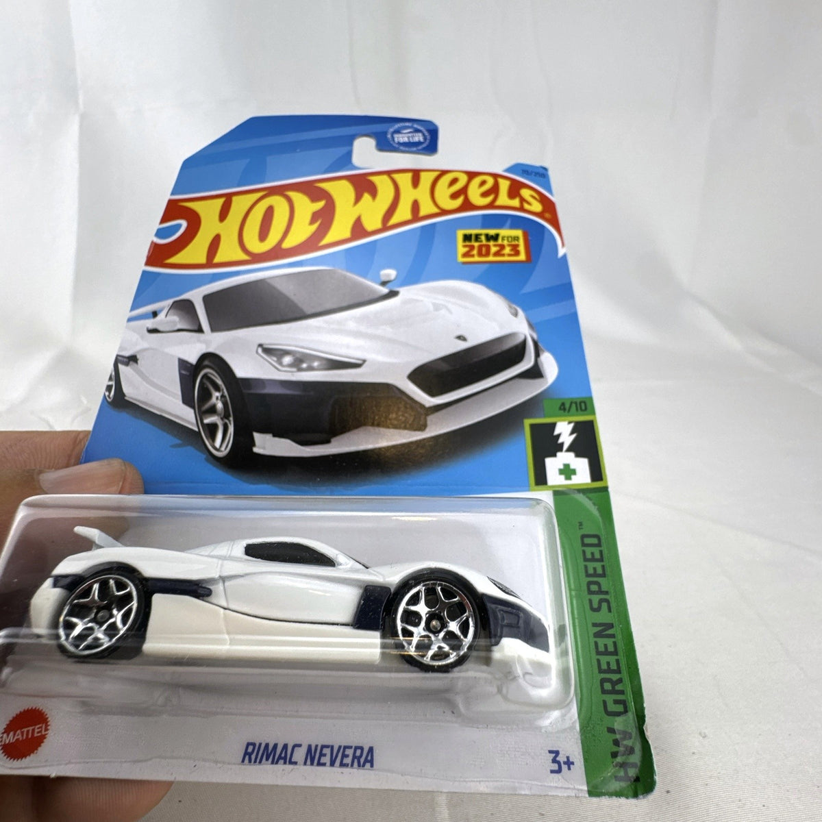 Sealed 2023 Hot Wheels 1:64 scale diecast Rimac Nevera car in white on original blister card.