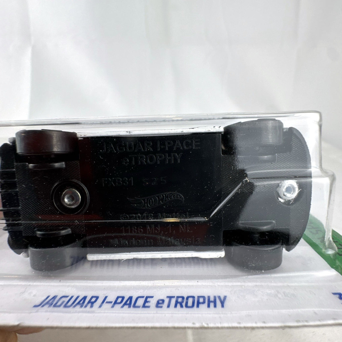 Hot Wheels 1:64 scale Jaguar I-Pace eTrophy diecast race car in white sealed on original blister card