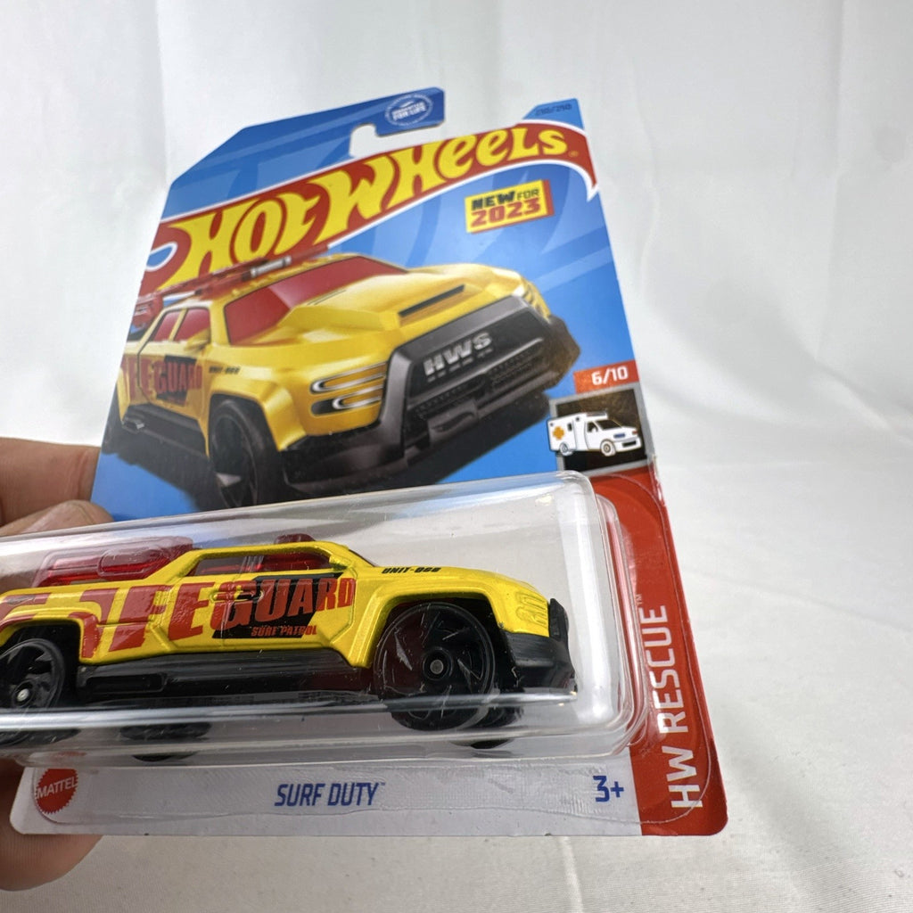 Hot Wheels 2023 Surf Duty yellow lifeguard truck diecast 1:64 scale in original sealed blister pack
