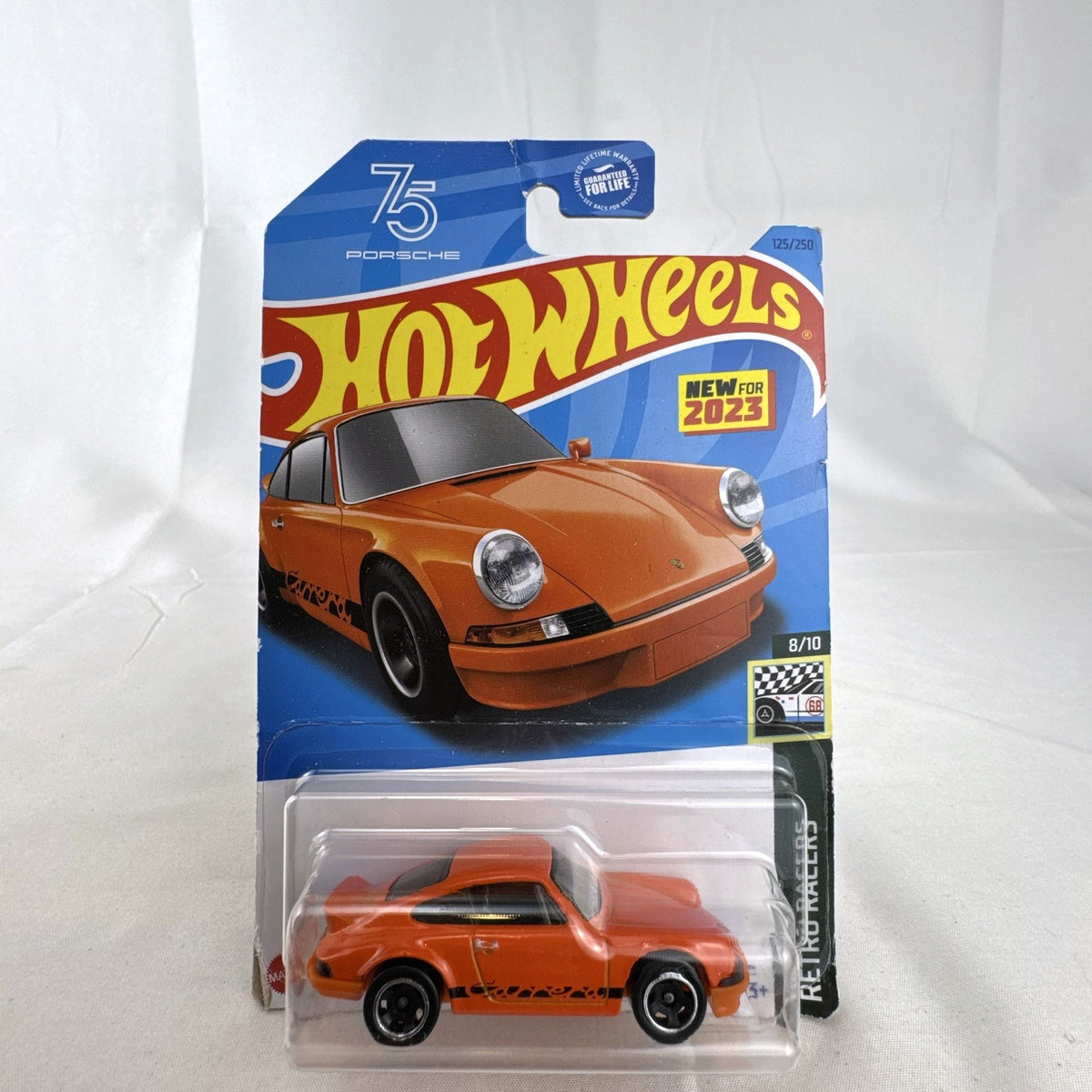 Factory sealed Hot Wheels 1:64 scale orange Porsche 911 Carrera RS 2.7 diecast car on card
