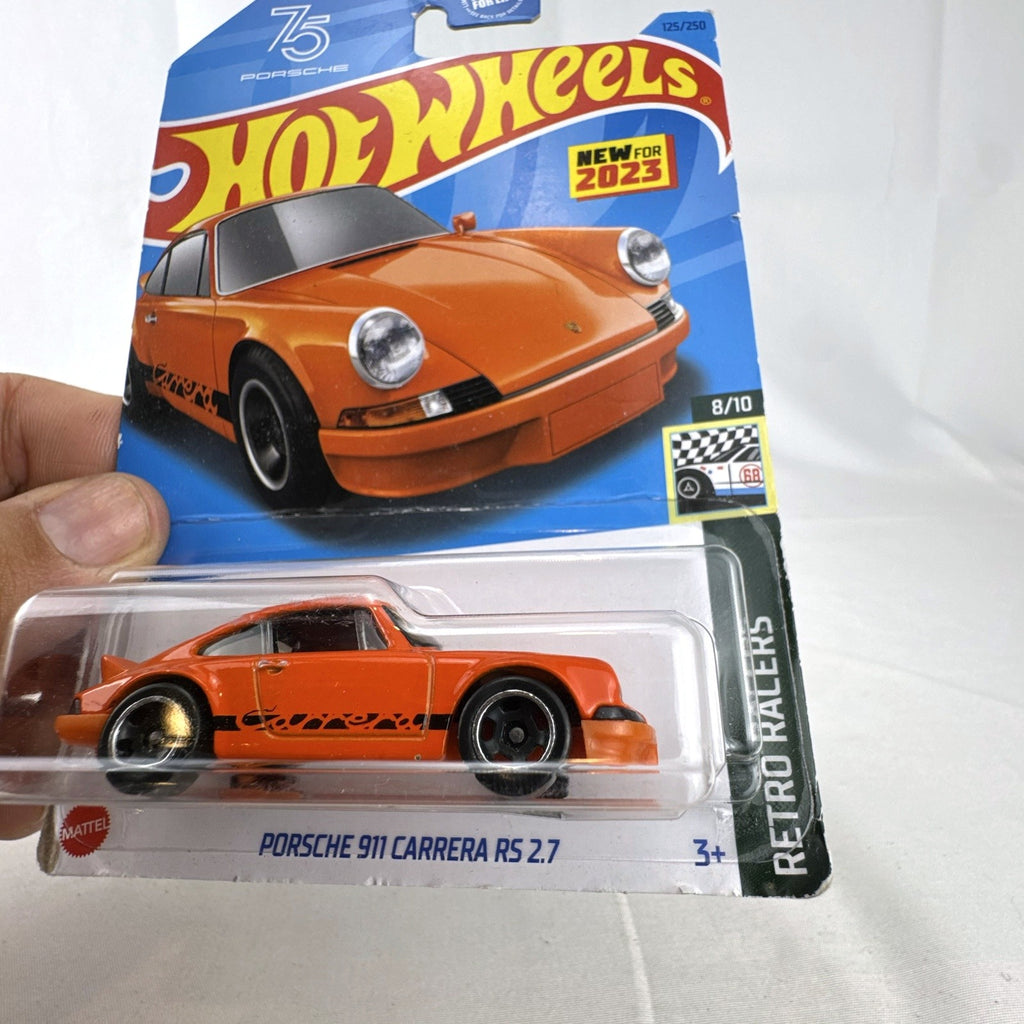 Factory sealed Hot Wheels 1:64 scale orange Porsche 911 Carrera RS 2.7 diecast car on card