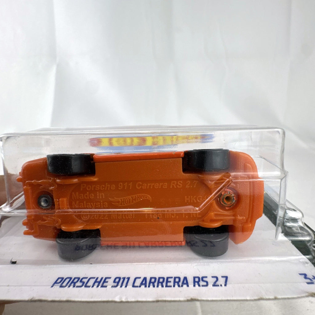 Factory sealed Hot Wheels 1:64 scale orange Porsche 911 Carrera RS 2.7 diecast car on card