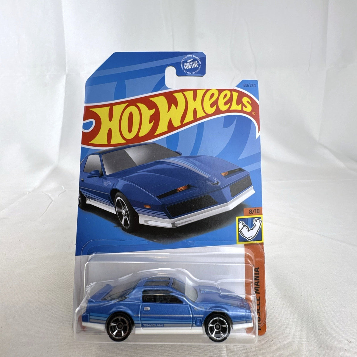 Hot Wheels 1:64 scale 1984 Pontiac Firebird Trans Am in metallic blue, factory sealed on original card.