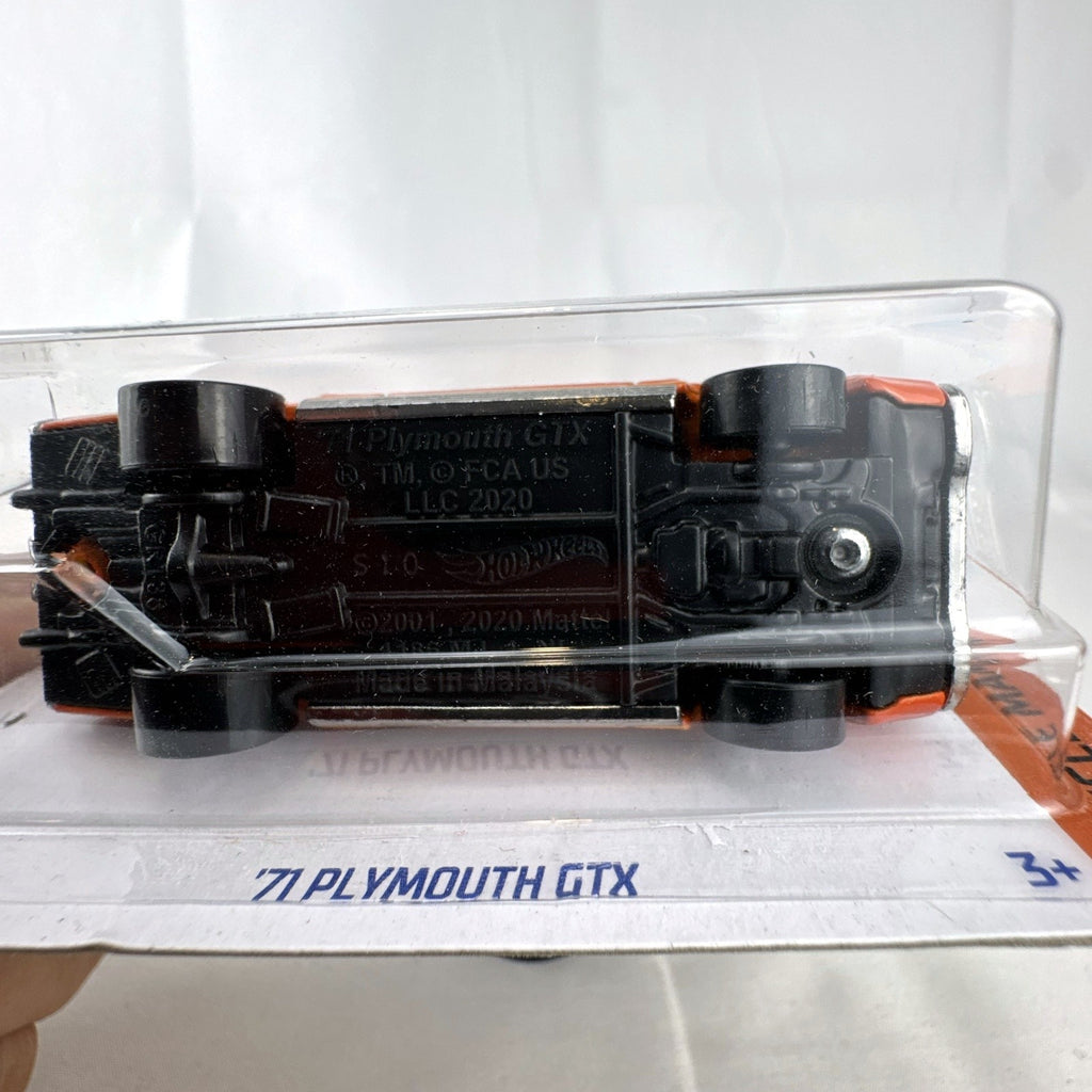 Hot Wheels 1971 Plymouth GTX 1:64 scale diecast car in orange sealed on original card