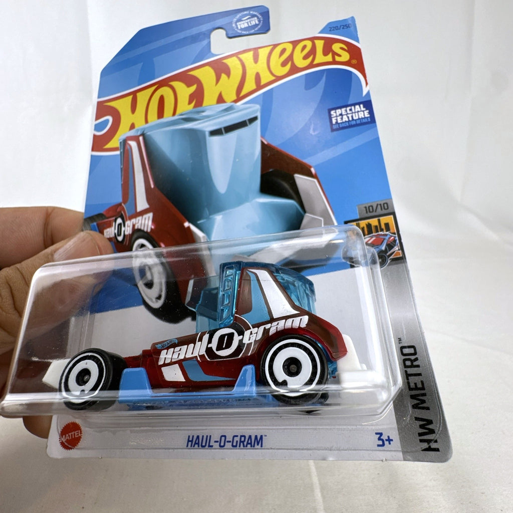 Hot Wheels Haul-O-Gram 1:64 scale translucent red diecast truck factory sealed in blister pack