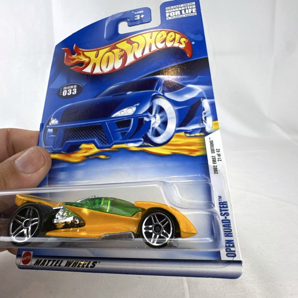2002 Hot Wheels First Editions Open Road-Ster gold 1:64 scale diecast car sealed in original card packaging.