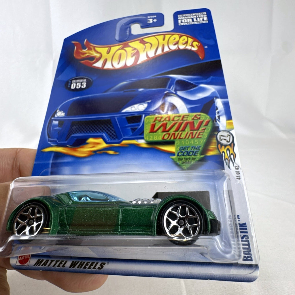Hot Wheels 2002 First Editions Ballistik 1:64 diecast car in metallic green, unopened on original packaging.