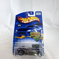 Hot Wheels 2002 First Editions Rocket Oil Special 1:64 scale diecast car in deep purple with chrome chassis, sealed in package.