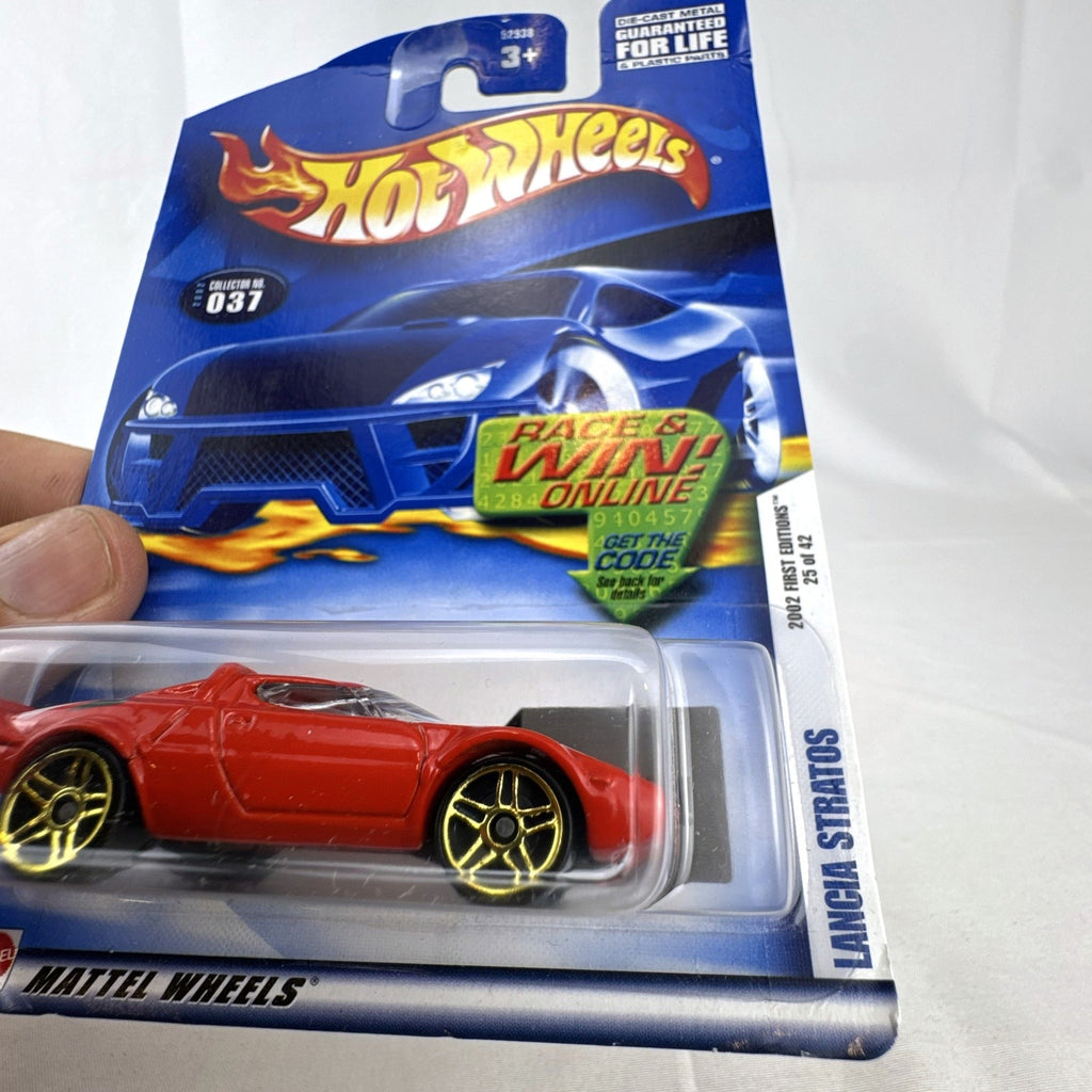 Sealed 2002 Hot Wheels First Editions red Lancia Stratos 1:64 scale diecast car on cardback with gold wheels.