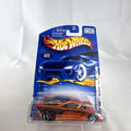 Hot Wheels 2002 First Editions Nomadder What 1:64 scale diecast car in metallic orange, sealed on original card package.
