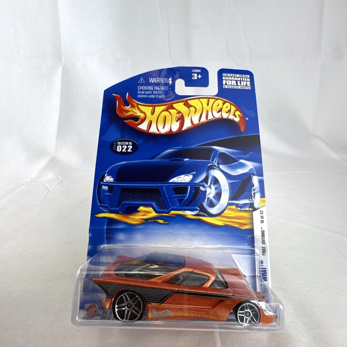 Hot Wheels 2002 First Editions Nomadder What 1:64 scale diecast car in metallic orange, sealed on original card package.