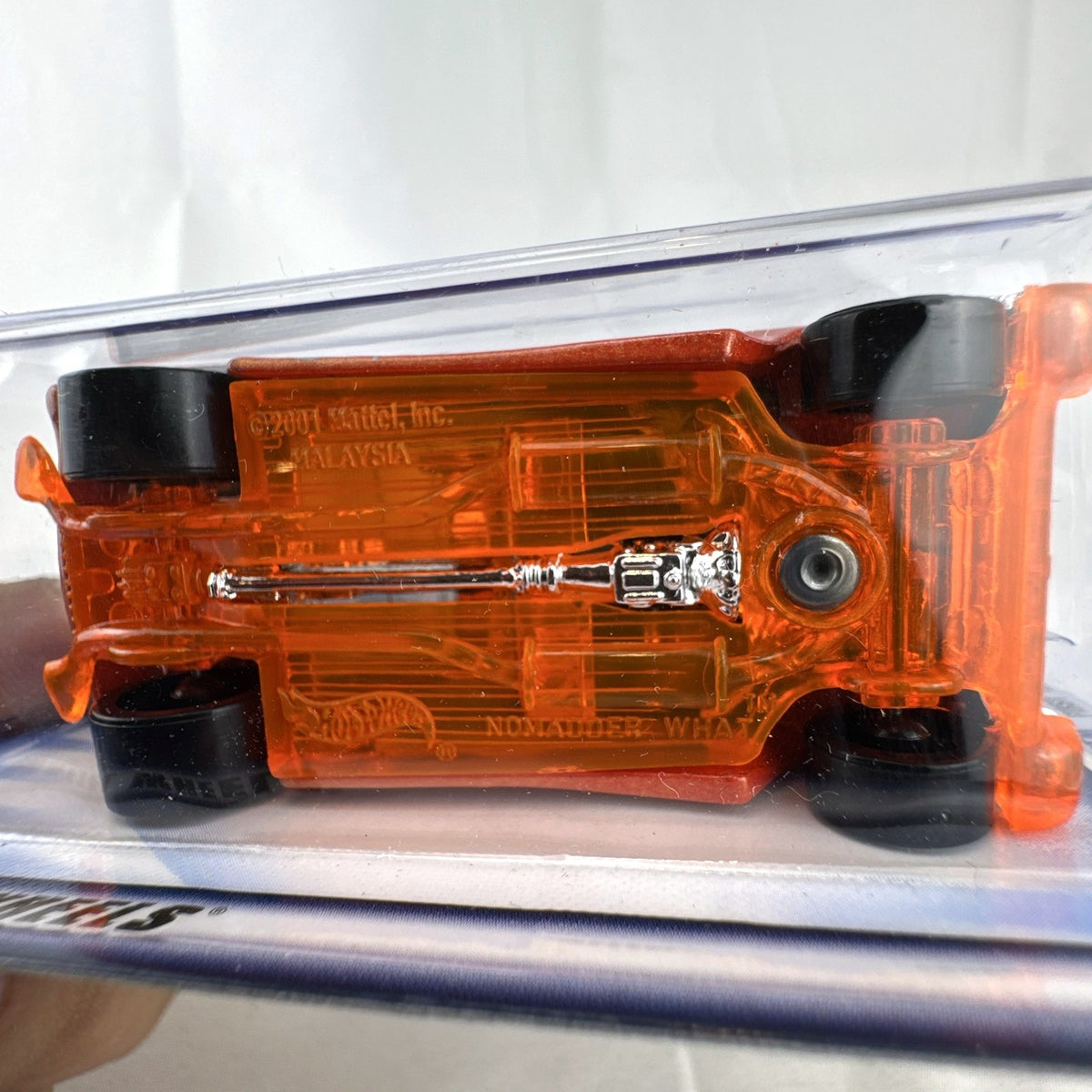 Hot Wheels 2002 First Editions Nomadder What 1:64 scale diecast car in metallic orange, sealed on original card package.