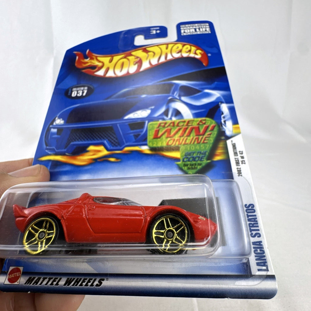 Factory sealed 2002 Hot Wheels First Editions red Lancia Stratos diecast car in 1:64 scale.