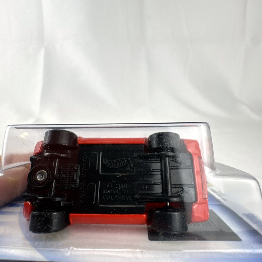 Factory sealed 2002 Hot Wheels First Editions red Lancia Stratos diecast car in 1:64 scale.
