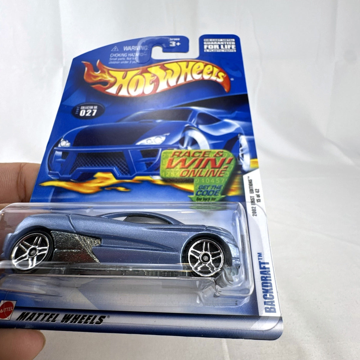 Sealed 2002 Hot Wheels First Editions Backdraft diecast car in metallic blue on original card package.