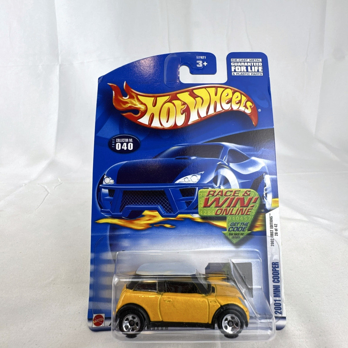 Hot Wheels 2002 First Editions 2001 Mini Cooper diecast car in yellow with white roof, sealed on card