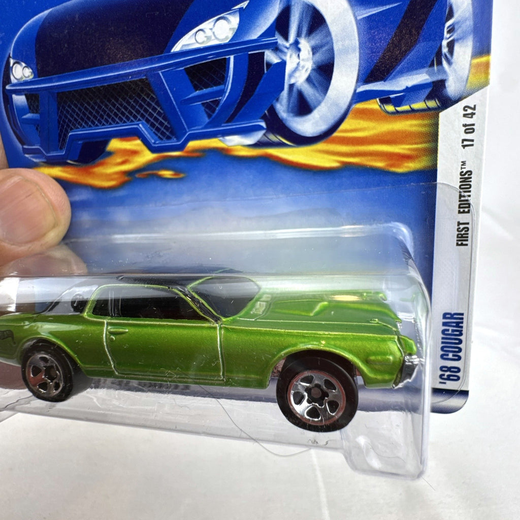 Hot Wheels 2002 First Editions 1968 Mercury Cougar diecast car in metallic olive green, sealed in original packaging.