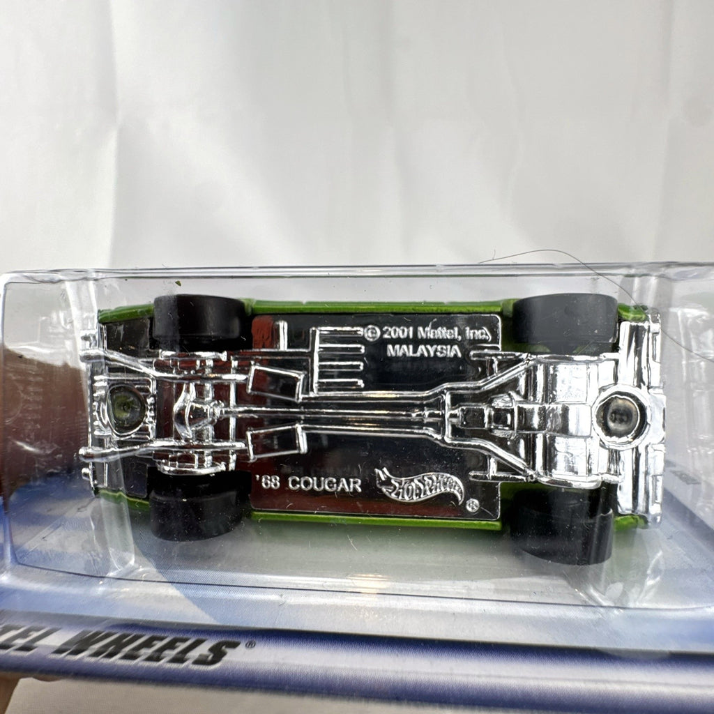 Hot Wheels 2002 First Editions 1968 Mercury Cougar diecast car in metallic olive green, sealed in original packaging.