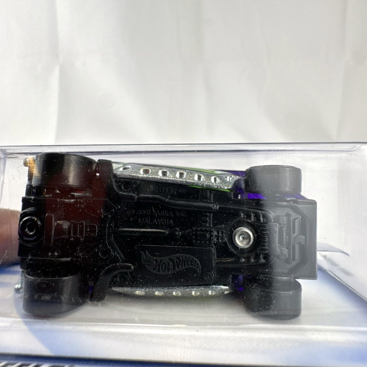 2002 Hot Wheels First Editions Jester 1:64 scale diecast car sealed on card in deep purple and black.