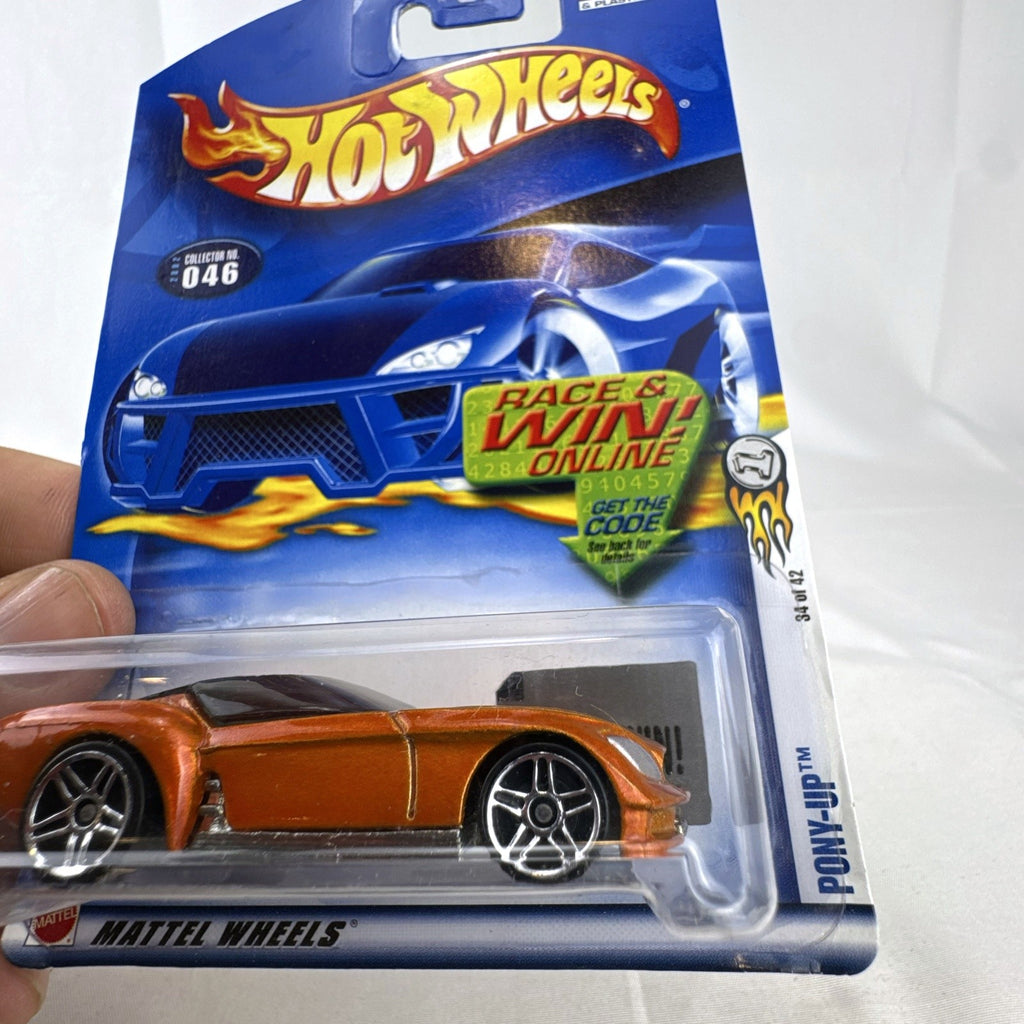 Sealed 2002 Hot Wheels First Editions Pony-Up 1:64 diecast car in metallic orange on original packaging card