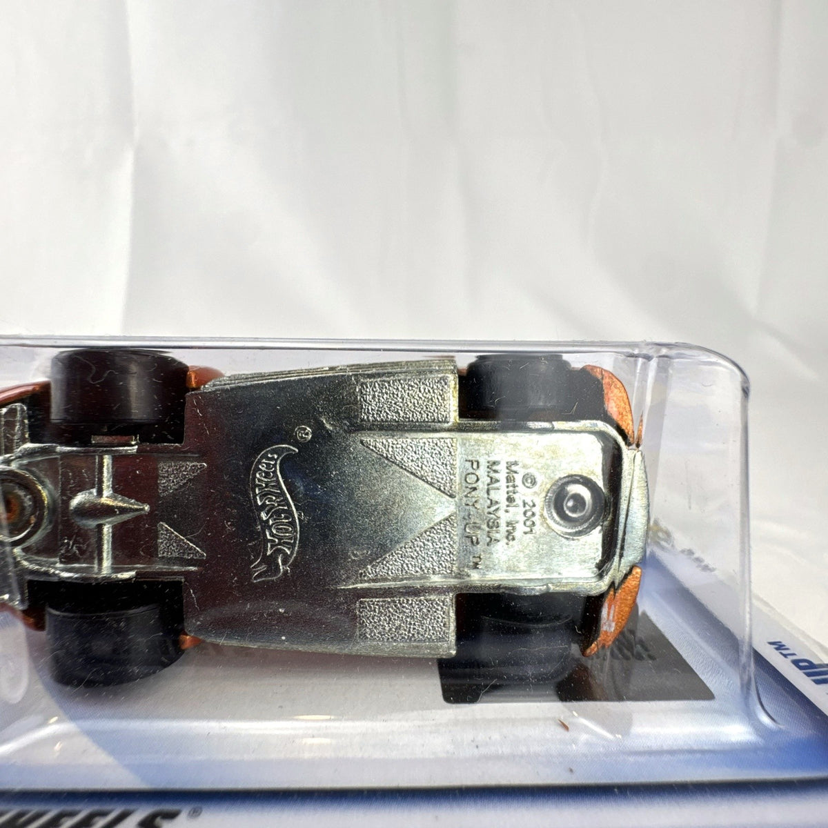 Sealed 2002 Hot Wheels First Editions Pony-Up 1:64 diecast car in metallic orange on original packaging card