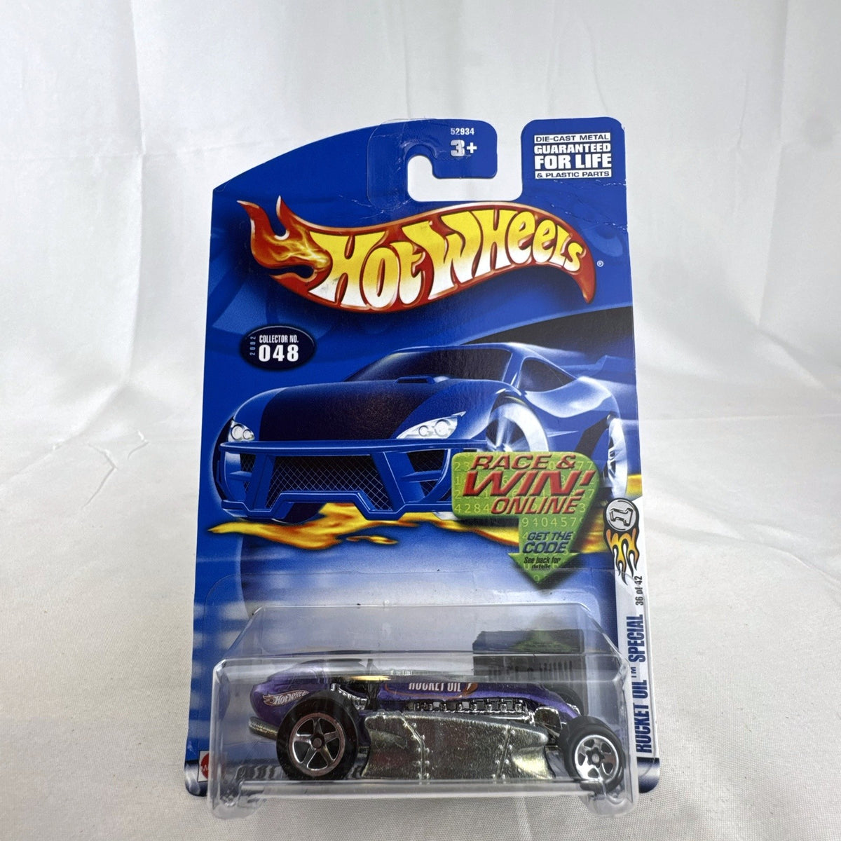 Hot Wheels 2002 First Editions Rocket Oil Special 1:64 scale diecast car in metallic purple, sealed on card.