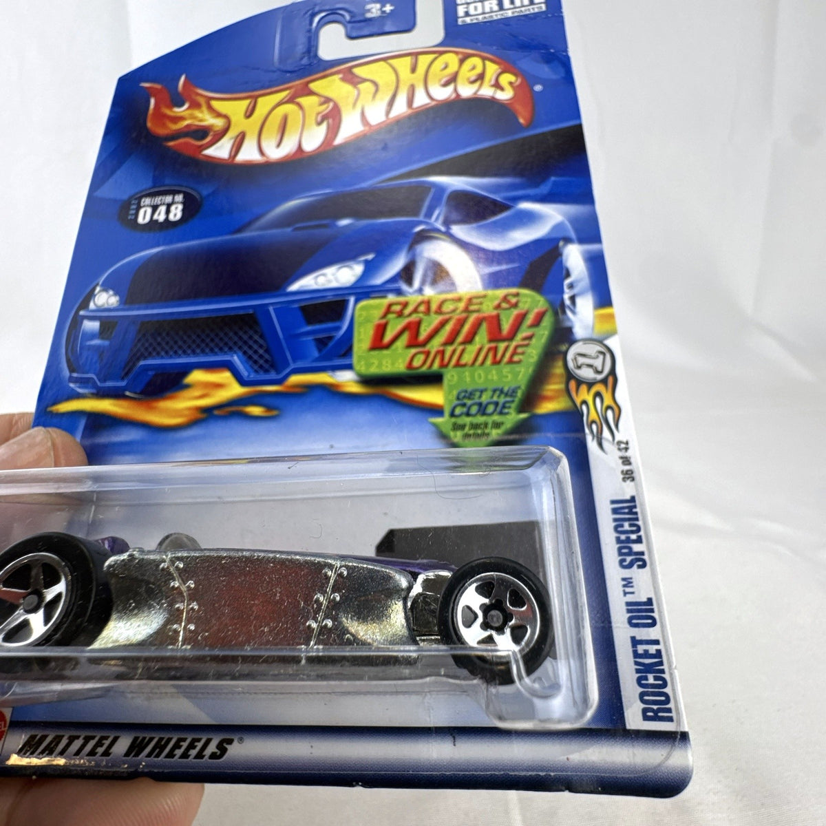 Hot Wheels 2002 First Editions Rocket Oil Special 1:64 scale diecast car in metallic purple, sealed on card.