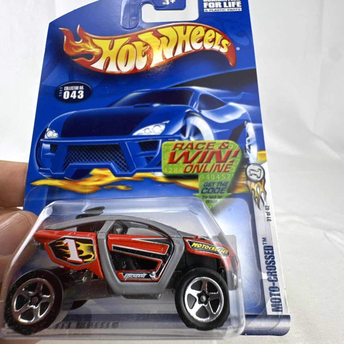 Hot Wheels 2002 First Editions Moto-Crossed diecast off-road buggy sealed in original blister card packaging.