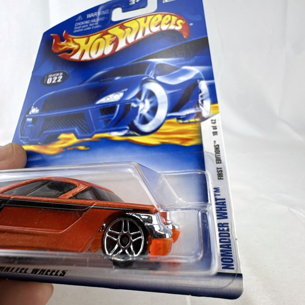 Sealed 2002 Hot Wheels First Editions Nomadder What 1:64 diecast car in metallic orange on original card