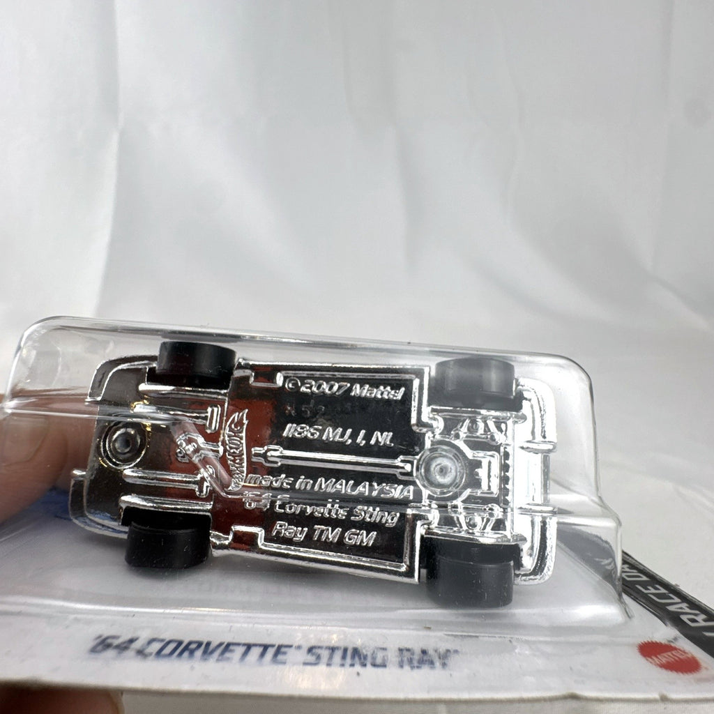 Hot Wheels 1:64 1964 Chevrolet Corvette Sting Ray in white from the HW Race Day series, factory sealed on blister card.