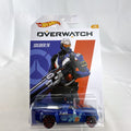 Hot Wheels 1:64 scale Solid Muscle diecast car featuring Blizzard Overwatch hero Soldier: 76 artwork in factory sealed card.
