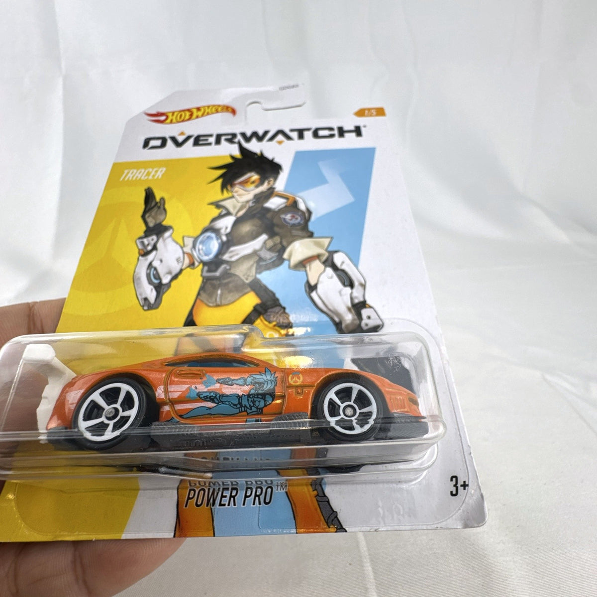 Hot Wheels 1:64 scale diecast Power Pro car featuring Overwatch Tracer graphics in original blister package