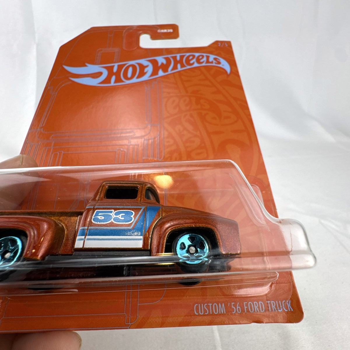 Hot Wheels Custom '56 Ford Truck 1:64 scale diecast in metallic orange from 53rd Anniversary series