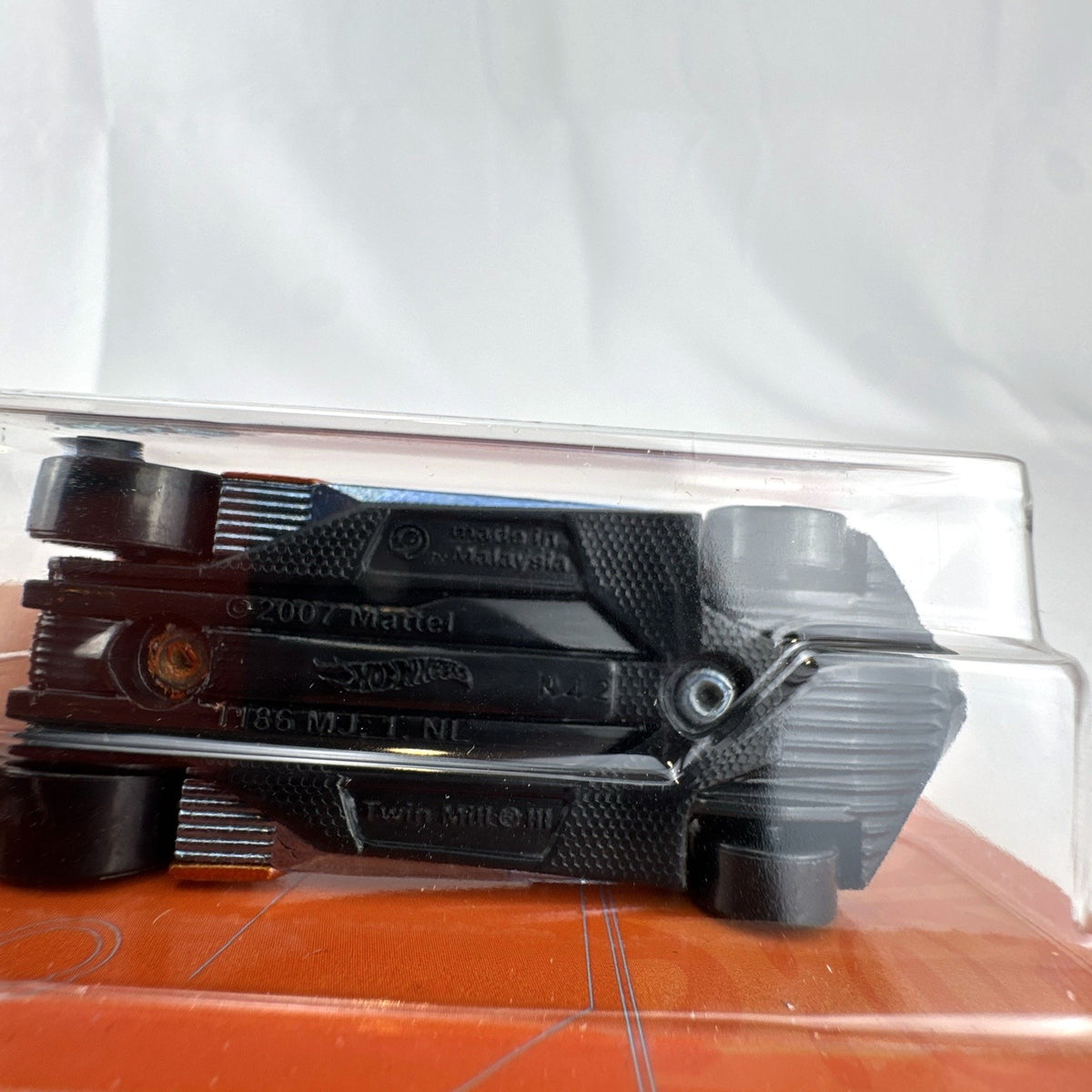 Hot Wheels Twin Mill III 1:64 scale diecast car in satin metallic orange 53rd Anniversary packaging.