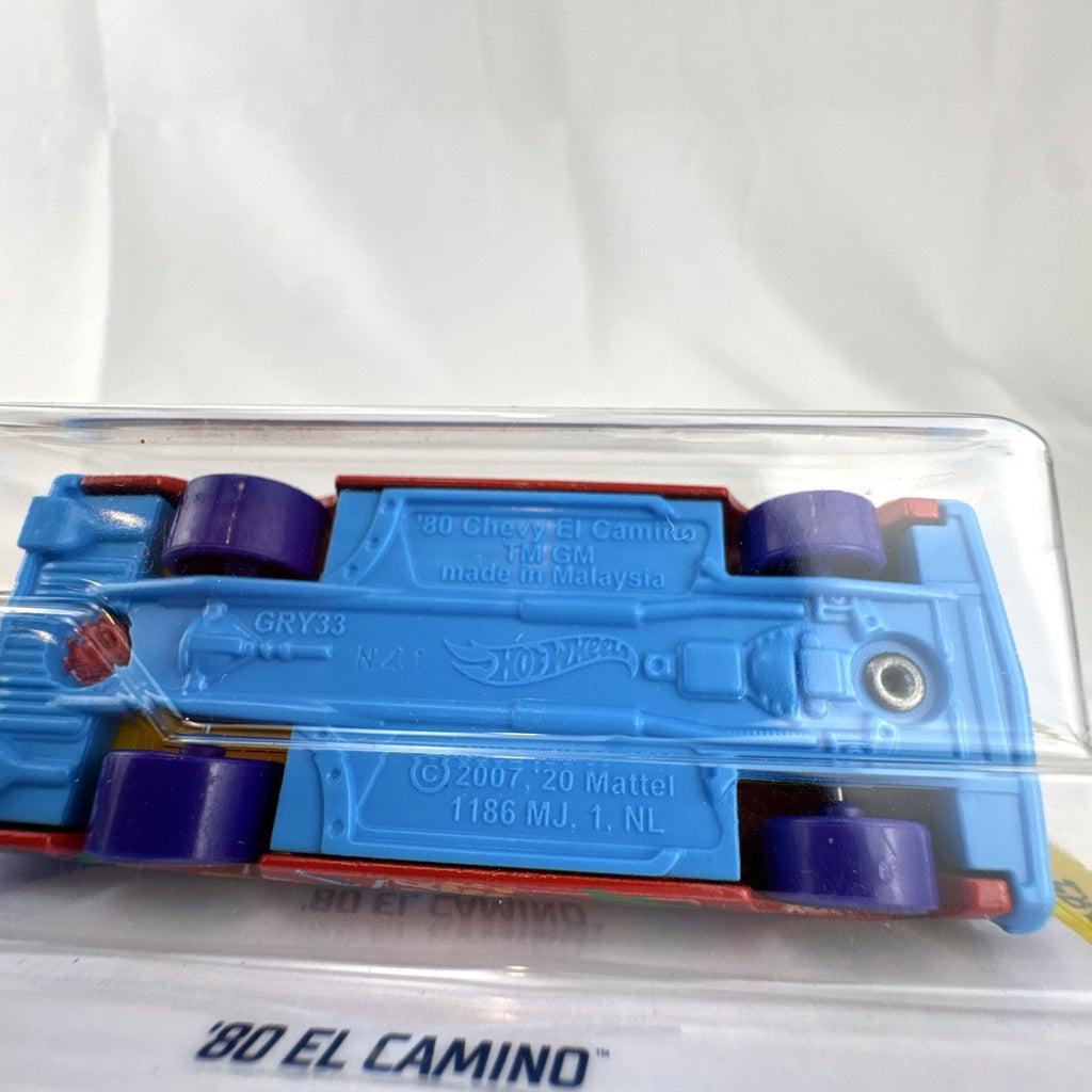Hot Wheels 1:64 scale 1980 Chevrolet El Camino red diecast toy truck featuring pop-art graphics in sealed card package.