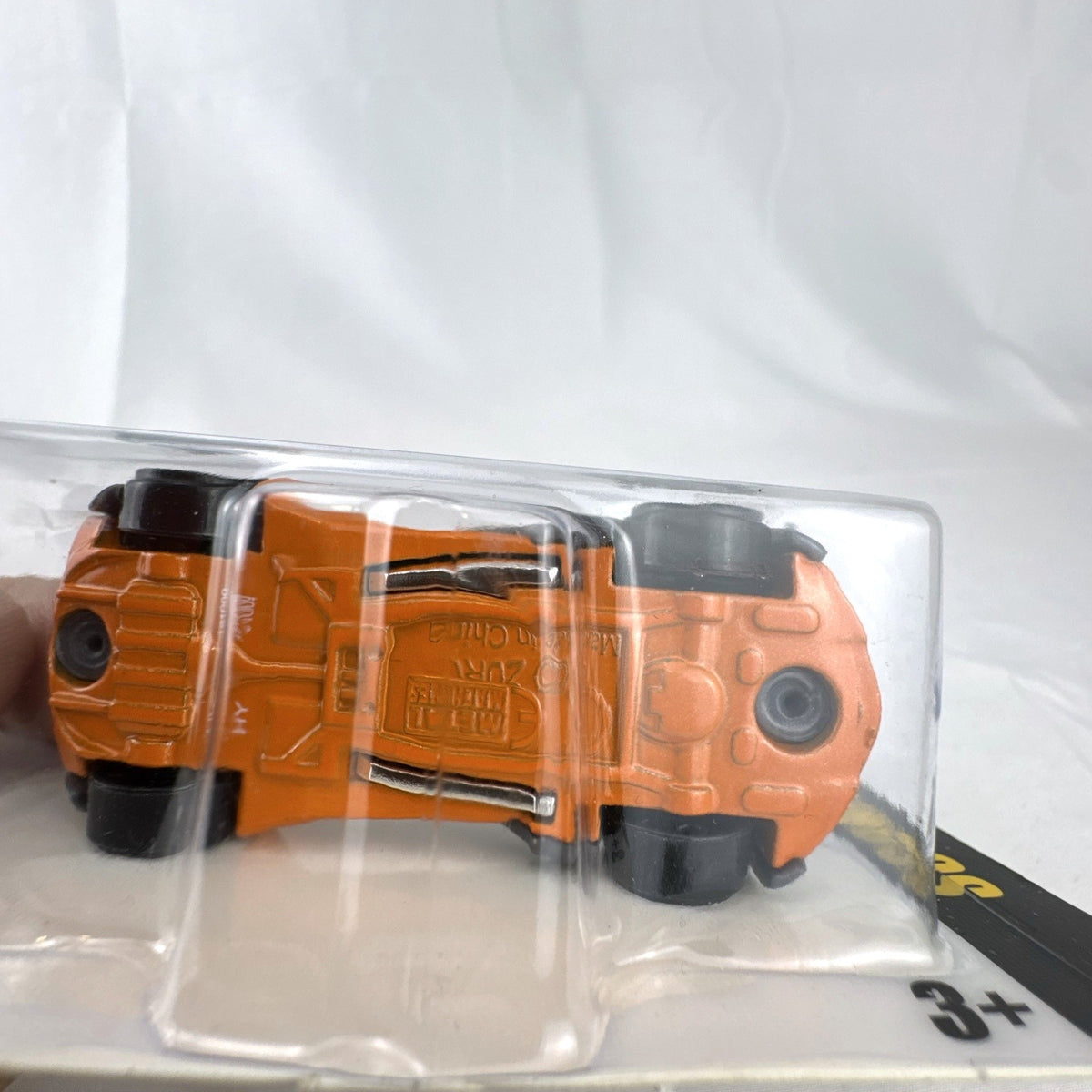 Zuru Metal Machines Scorpio 1:64 scale diecast car in factory sealed packaging, featuring dark gray and orange styling.