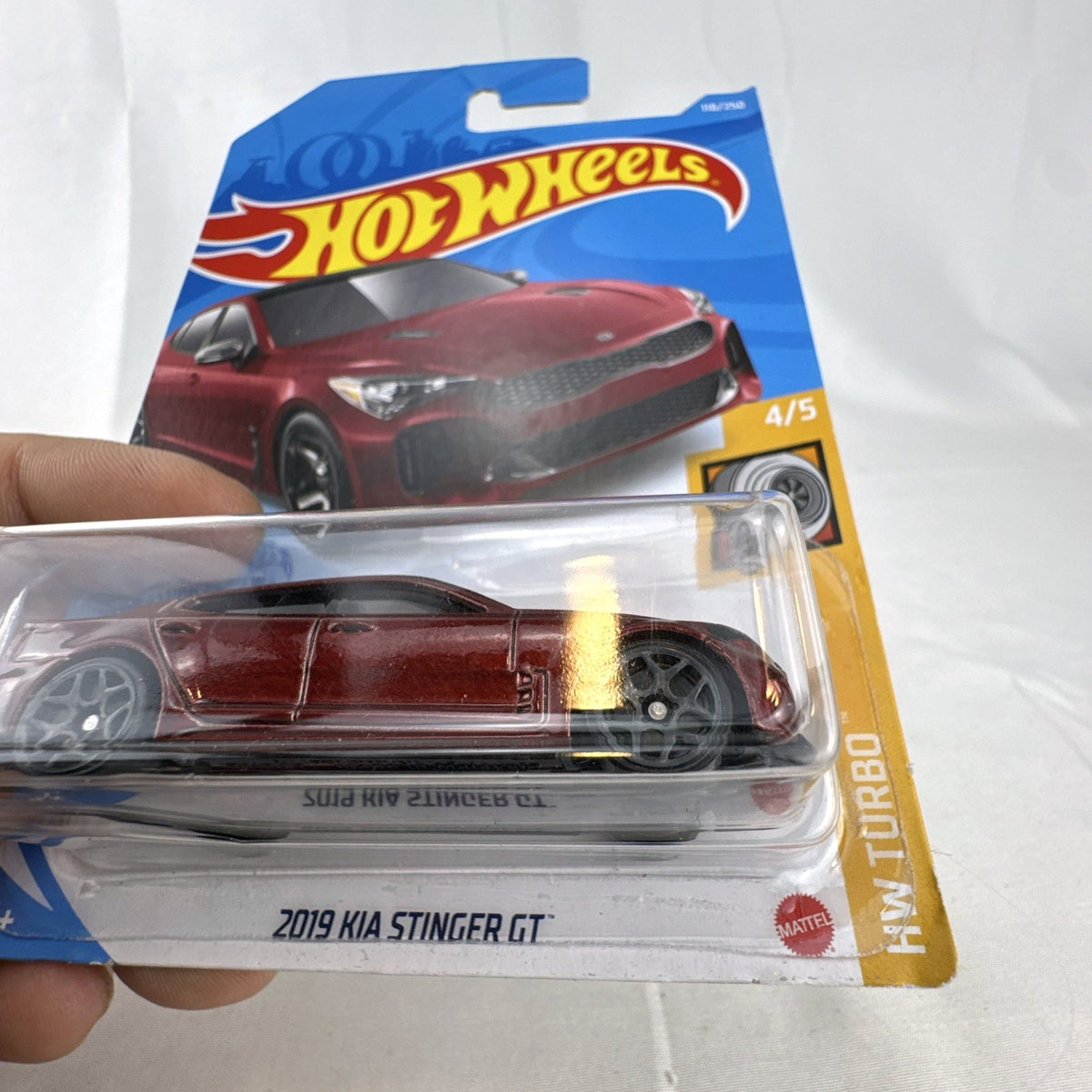 Hot Wheels 1:64 scale 2019 Kia Stinger GT diecast car in metallic red on original unopened card