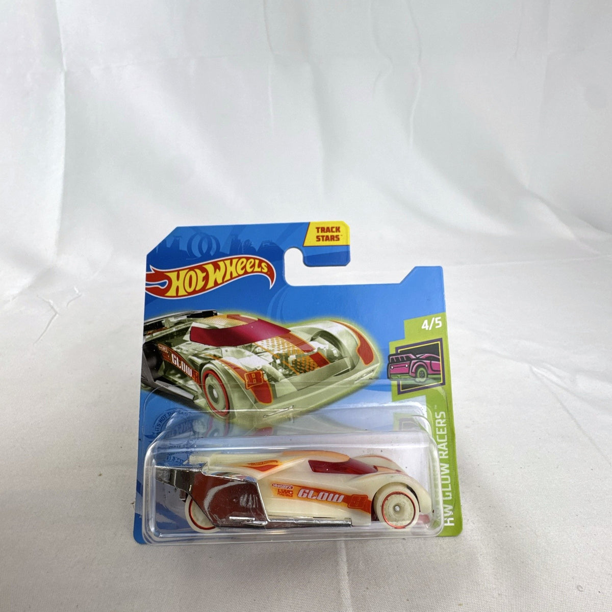 Hot Wheels 1:64 Lindster Prototype diecast car sealed on card in HW Glow Racers glow-in-the-dark white finish.
