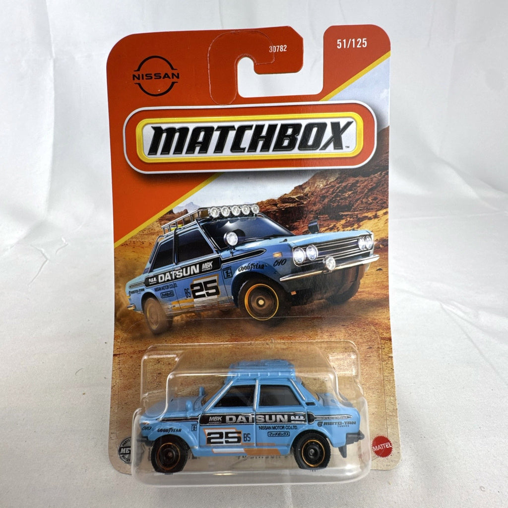 Factory sealed Matchbox 1970 Datsun 510 Rally 1:64 scale diecast car in light blue on original card packaging.