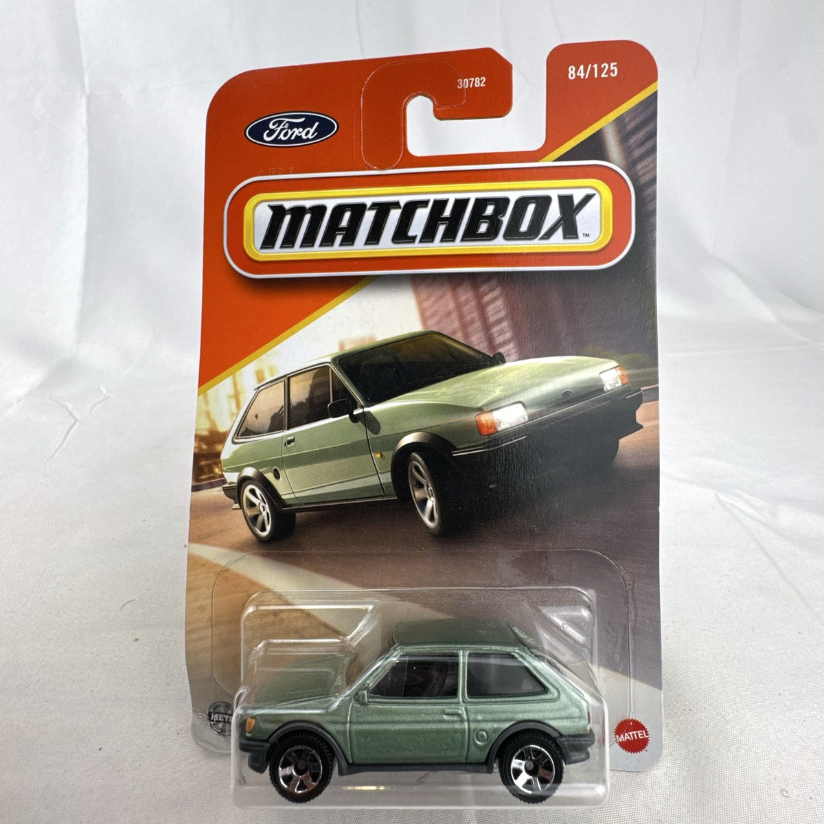 Matchbox 1:64 scale 1983 Ford Fiesta MK 2 diecast car in metallic green factory sealed on card.