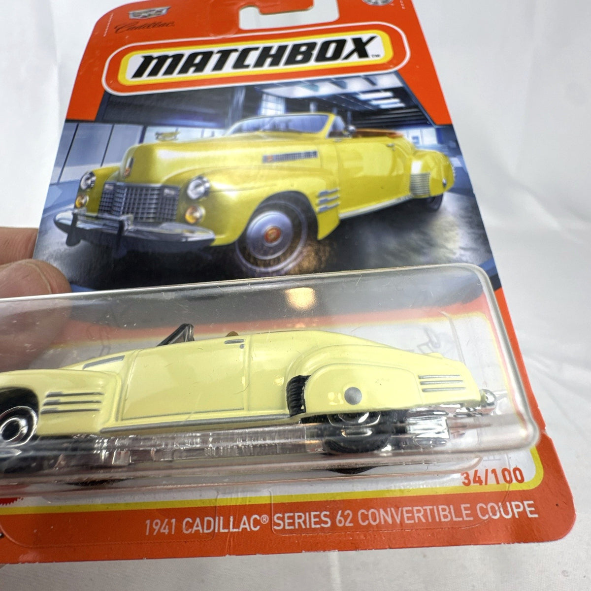 Matchbox 1:64 scale 1941 Cadillac Series 62 Convertible Coupe in yellow, sealed on original card package.