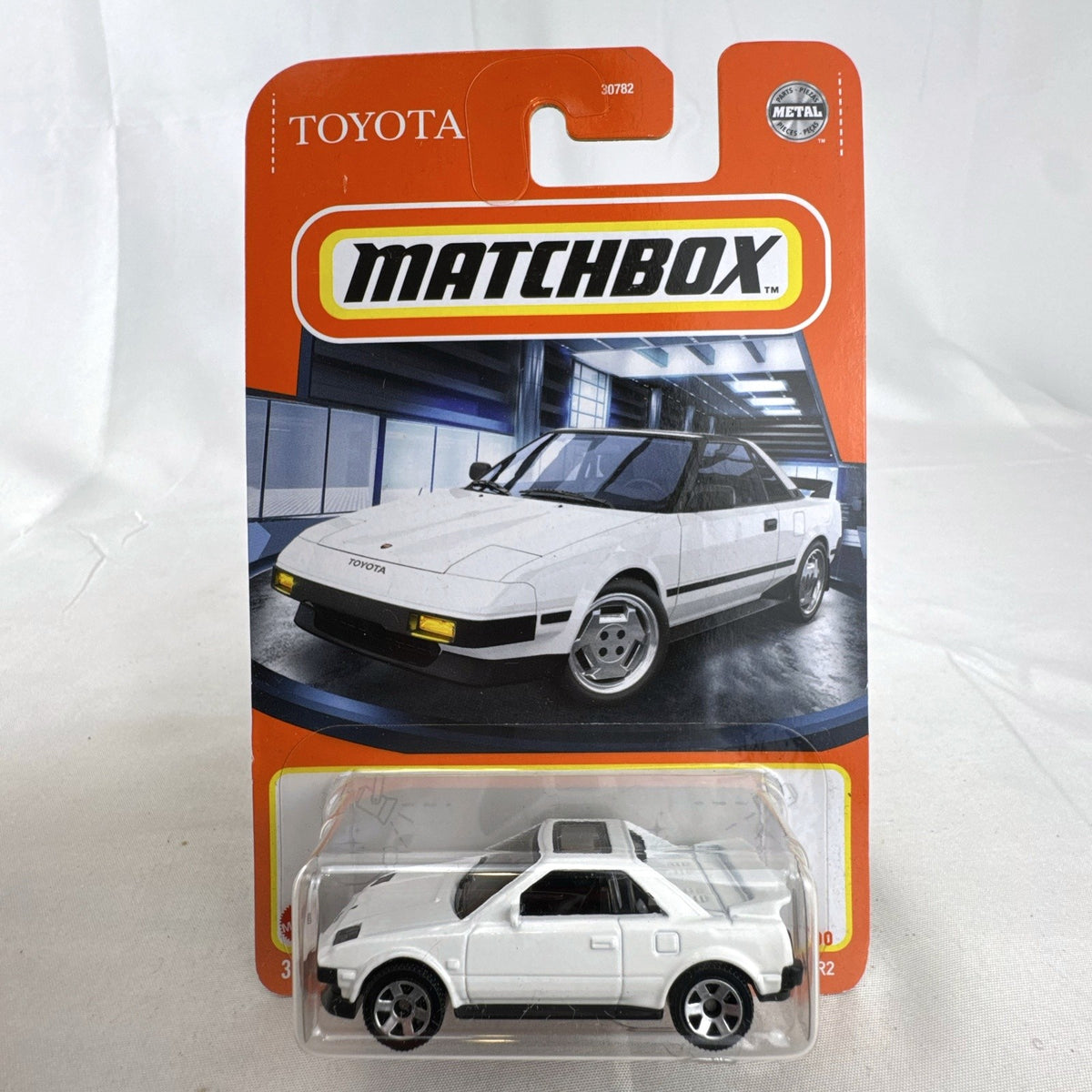 Matchbox 1984 Toyota MR2 1:64 scale white diecast car in original blister card packaging.